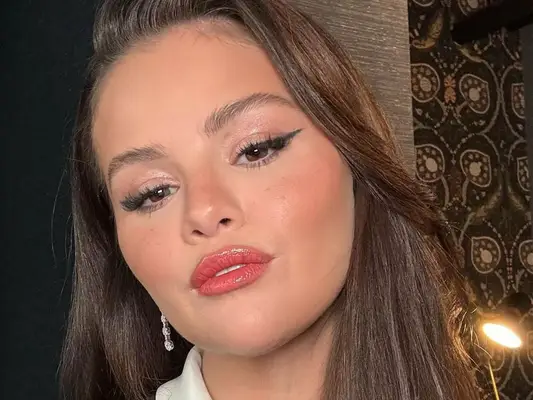 Selena Gomez wearing the blonzer trend.