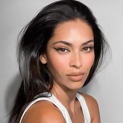 Model with reverse cat eye makeup with negative space winged liner