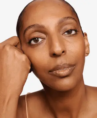 model wearing red Glossier eyeliner