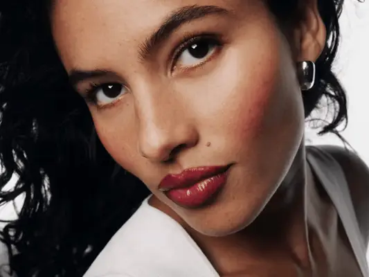 model wearing Glossier Black Cherry Collection