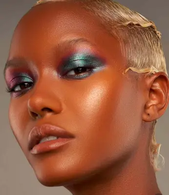model is wearing metallic green and red eyeshadow