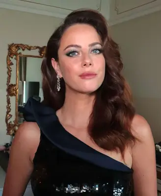 model wears light green metallic eyeshadow look