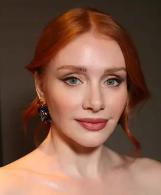 model wears cut crease eyeshadow style with visible winged eyeliner