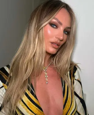 model is wearing a smoky eye with visible highlighted eyebrow