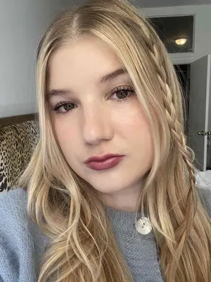 the author wearing Charlotte Tilbury Hollywood Beauty Icon Lipstick in 