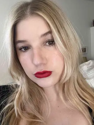 The author wearing Charlotte Tilbury Hollywood Icons Lipstick in Hollywood Vixen