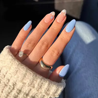 Pastel blue manicure with mini floral tips accent nails