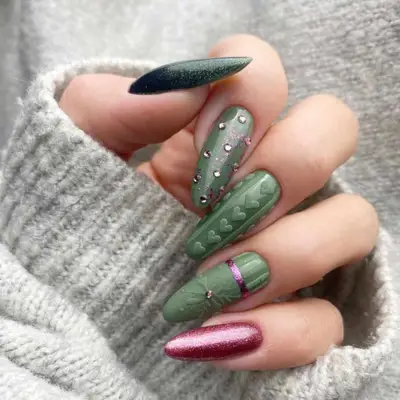 Green holiday nails with 3D sweater texture accent, sparkles, and red accent nail