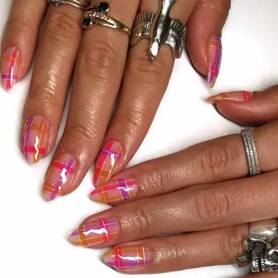 Plaid nails in neon pink, purple, and orange