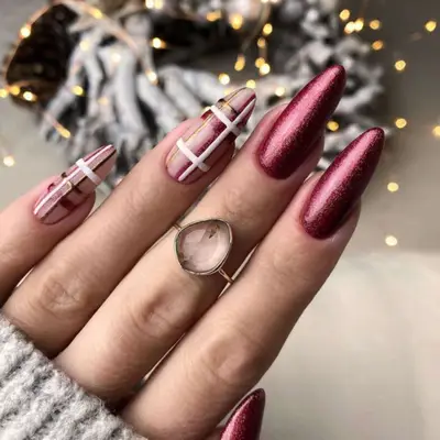 Holiday red shimmer manicure with sweater plaid accent nails