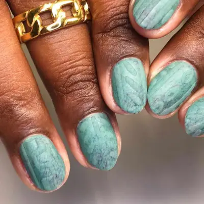 Turquoise sweater nails with textured finish