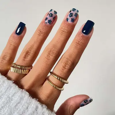 Navy nails with floral accents