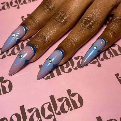 stiletto nails with rhinestone in the middle