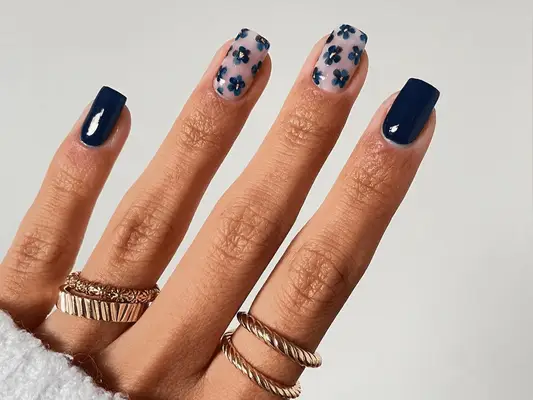 navy blue nails with floral accents