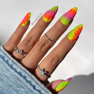 a neon tie-dye manicure