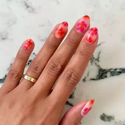 a hibiscus manicure on short nails