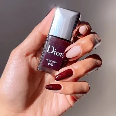 navy and white manicure with snowflake designs