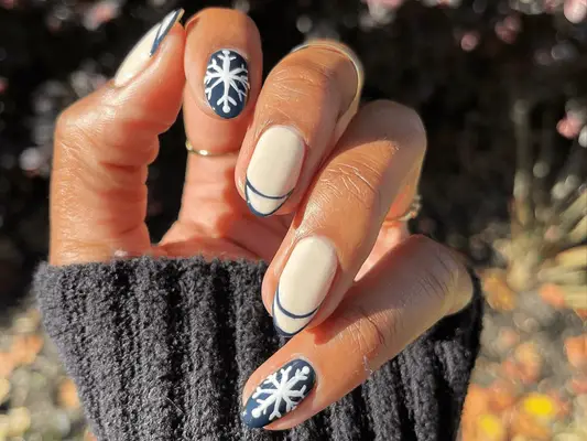 navy blue and white manicure with snowflakes