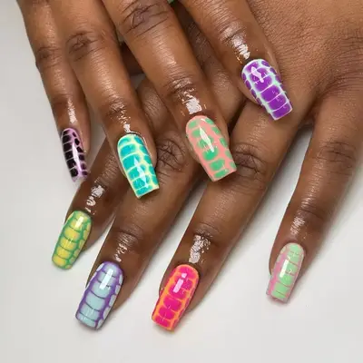 Animal print nails with a mix of pastel and bold colors