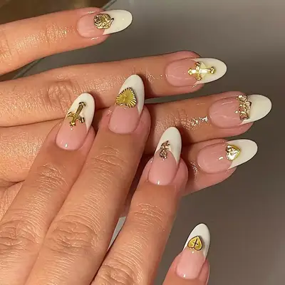 White French tips with 3D gold accents