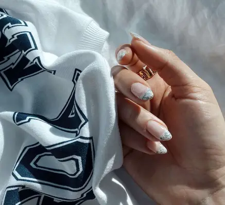 White French tips with black flecks 