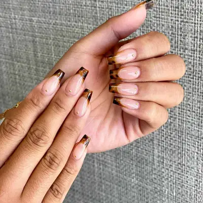 A tortoise-shell French manicure. 