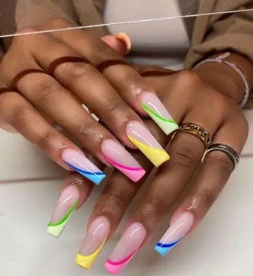 A rainbow swirl Coffin French manicure. 