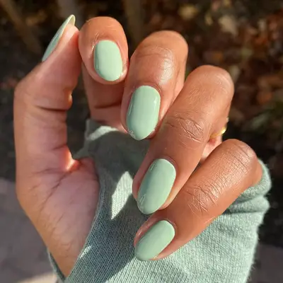 a solid mint green manicure