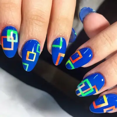 royal blue nails with neon block designs