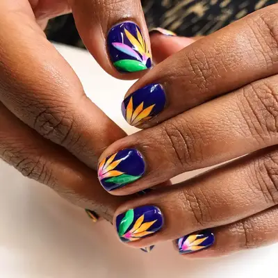 royal blue manicure with floral designs
