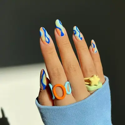 Royal blue, orange, and mint green nails