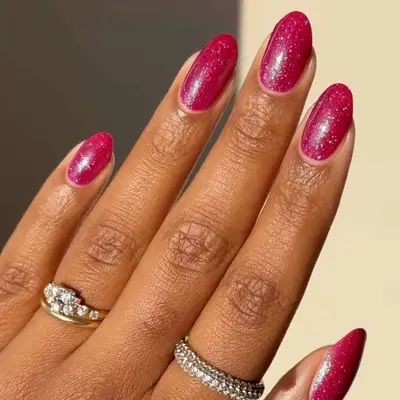 Sparkling berry-colored nails.