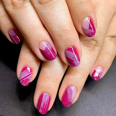 Geometric berry-colored manicure.