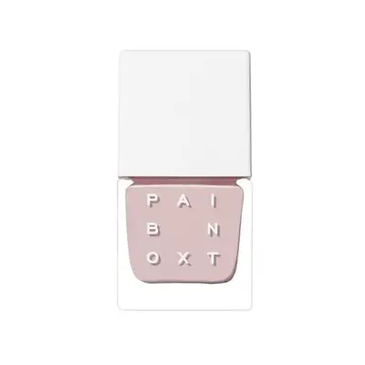 Bottle of dusty pale pink nail polish on a white background.