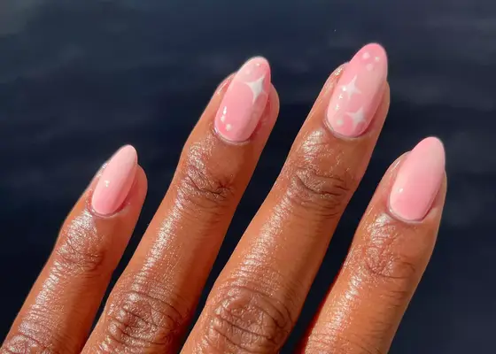 Pink airbrushed polish with white star accents
