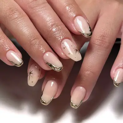 A manicure with chrome star and squiggle details