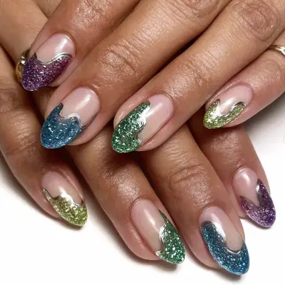 A manicure with multicolor swirling glittery tips