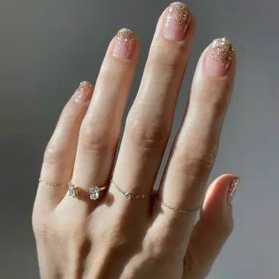 A manicure with glittery ombré tips