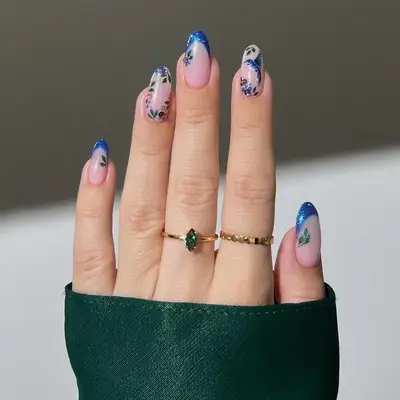 blue chrome french manicure with floral accents