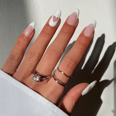 white manicure with heart cutout
