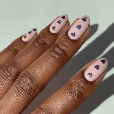light pink mani with silver heart stickers