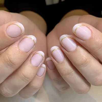 french manicure outline in gold nail polish