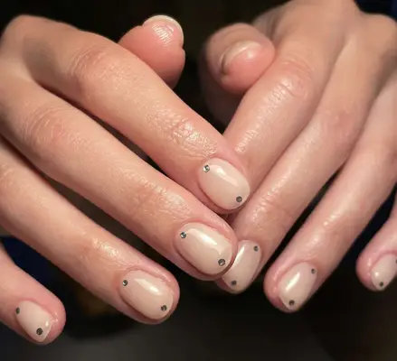 sheer nude nails with silver gems