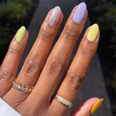 butter yellow, lavender, and sparkly pink short nails