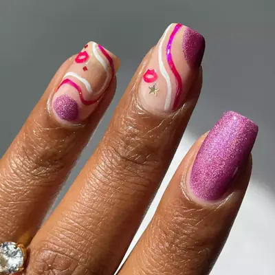 model with pink shimmery nails with star and lip stickers
