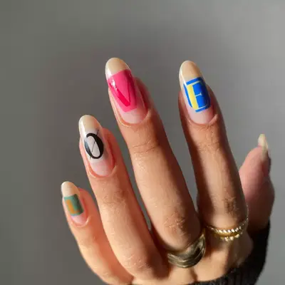 model with nails that spell 