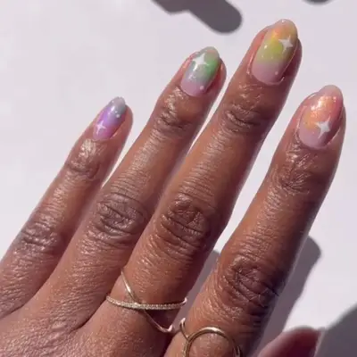 model with pastel nails with white starburst details