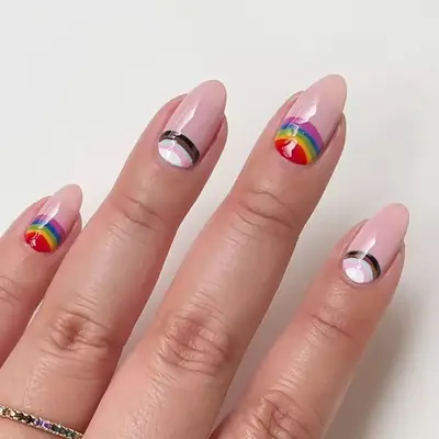 model with nails with rainbow flag and progress flag