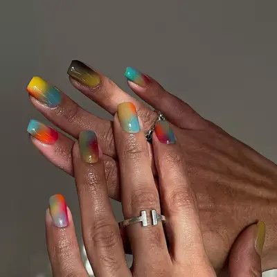 model with rainbow nails