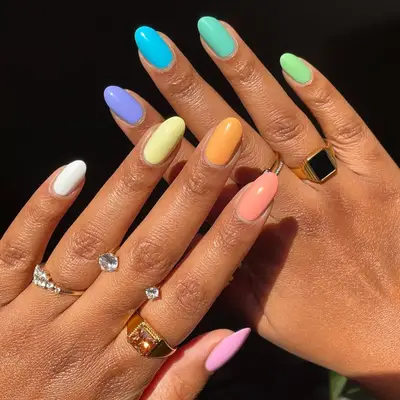 model with pastel rainbow nails